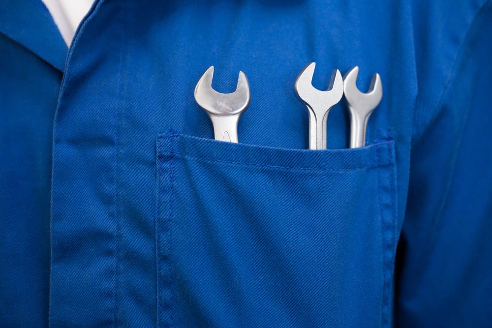 Mechanic with wrenches in pocket at the repair garage-1